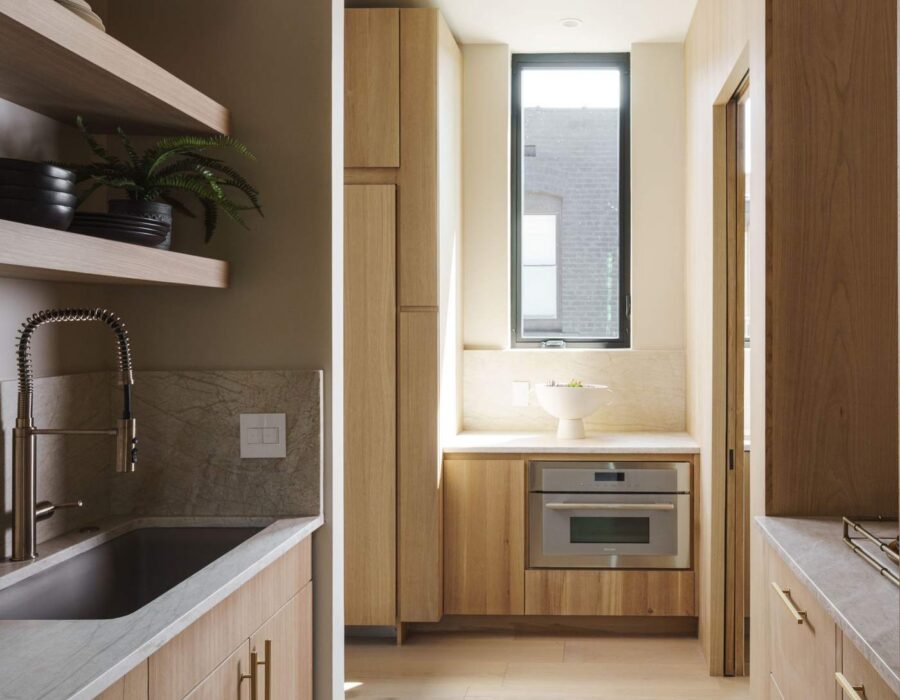 Butler's pantry with custom millwork and wide plank oak flooring