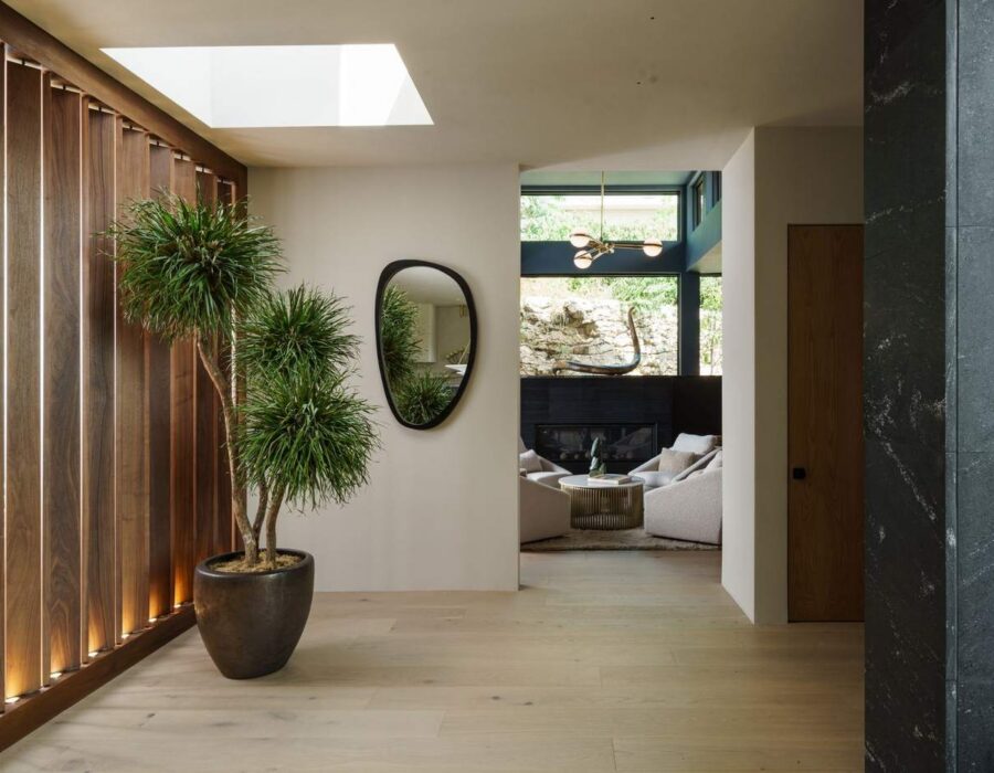 Sunlit lounge nook with skylight and natural wood ceiling beams