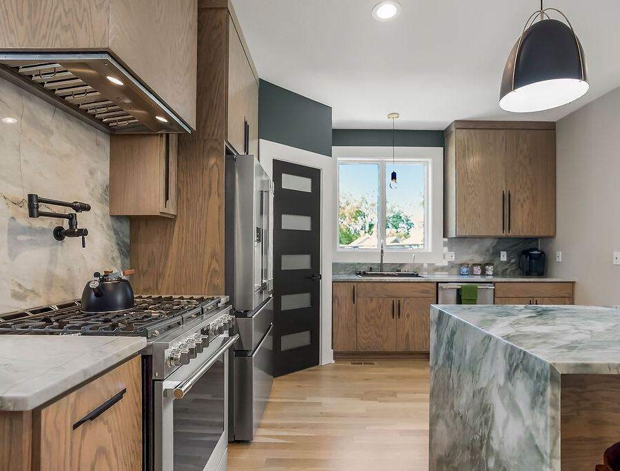 Marble kitchen island detail with pot filler