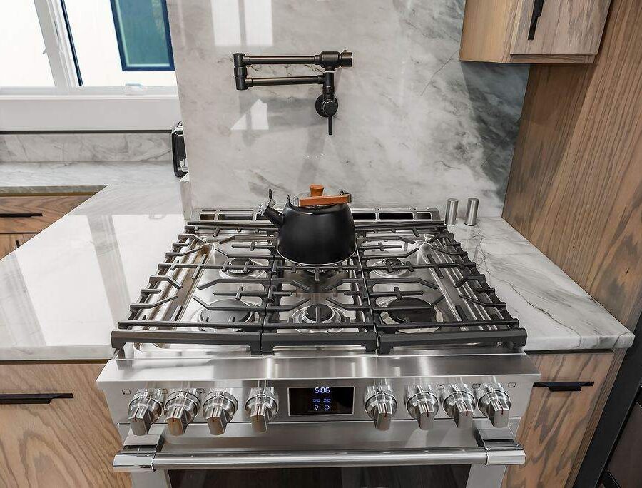 Professional-style range in a furnished corporate housing kitchen