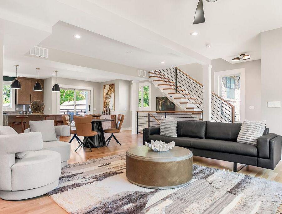 Combined living and dining area in a furnished corporate housing unit