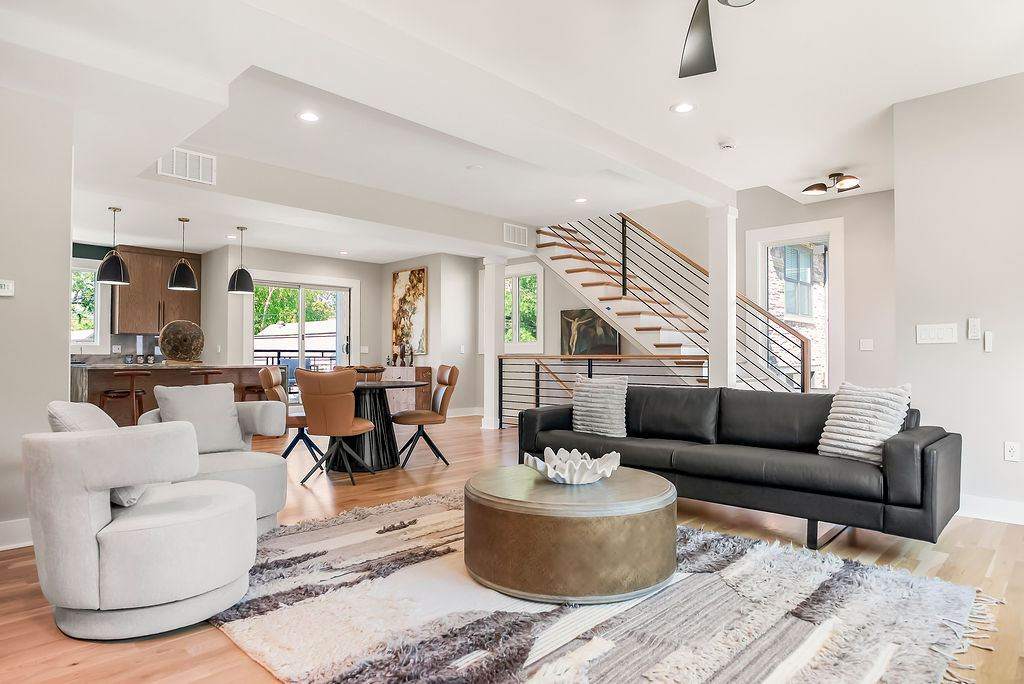 Combined living and dining area in a furnished corporate housing unit