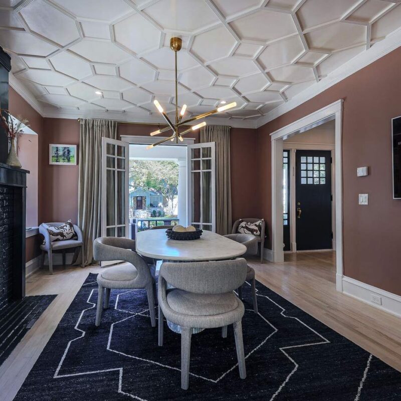 Living room with restored fireplace mantel and custom ceiling detail