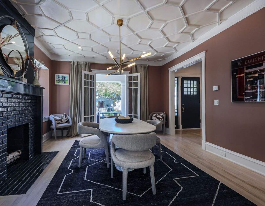Living room with restored fireplace mantel and custom ceiling detail