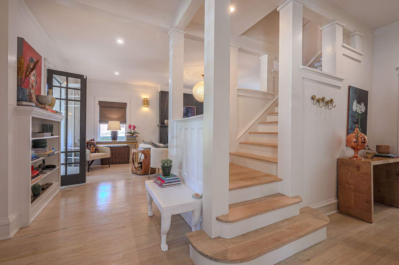 Living room and original staircase restored during a luxury home renovation