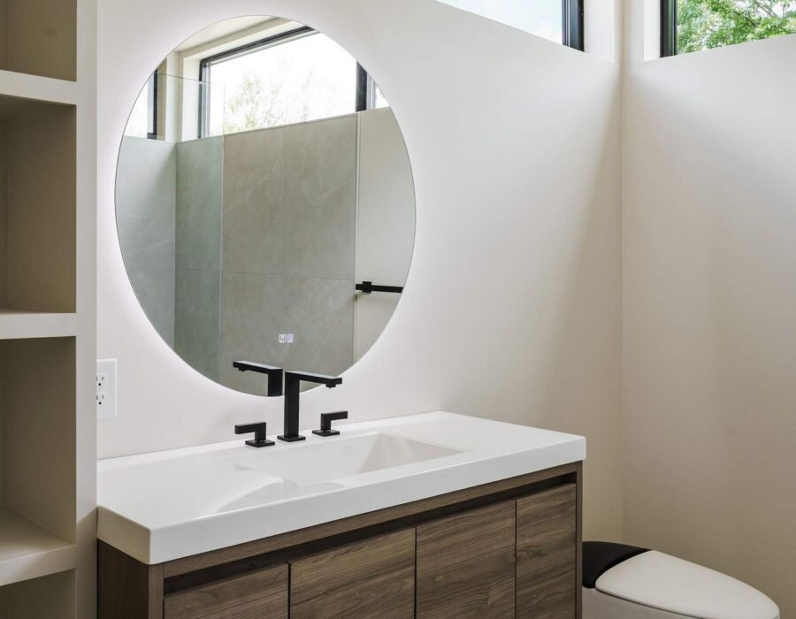 Secondary bathroom vanity with warm wood tones