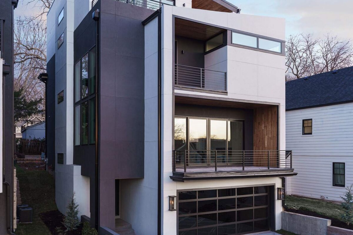 Modern multi-level custom home exterior with wood and stucco facade