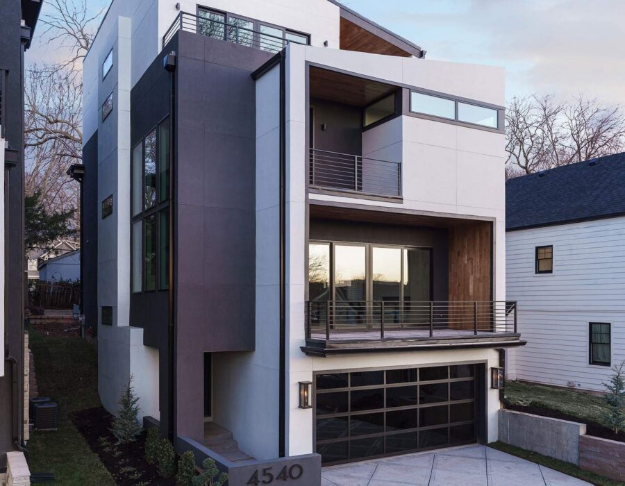 Modern multi-level custom home exterior with wood and stucco facade