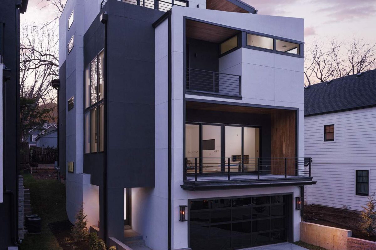 Custom home exterior glowing at dusk, designed and built by Hickok Homes