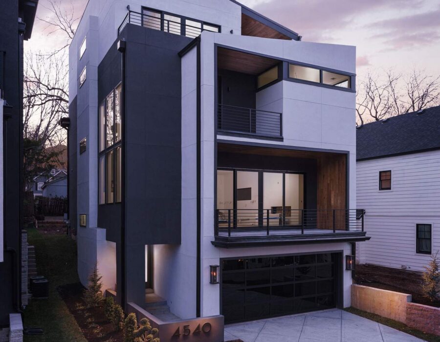 Custom home exterior glowing at dusk, designed and built by Hickok Homes