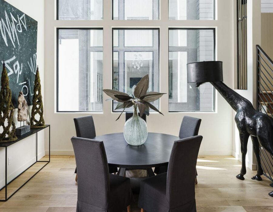 Dining room styled with sculptural art and designer lighting