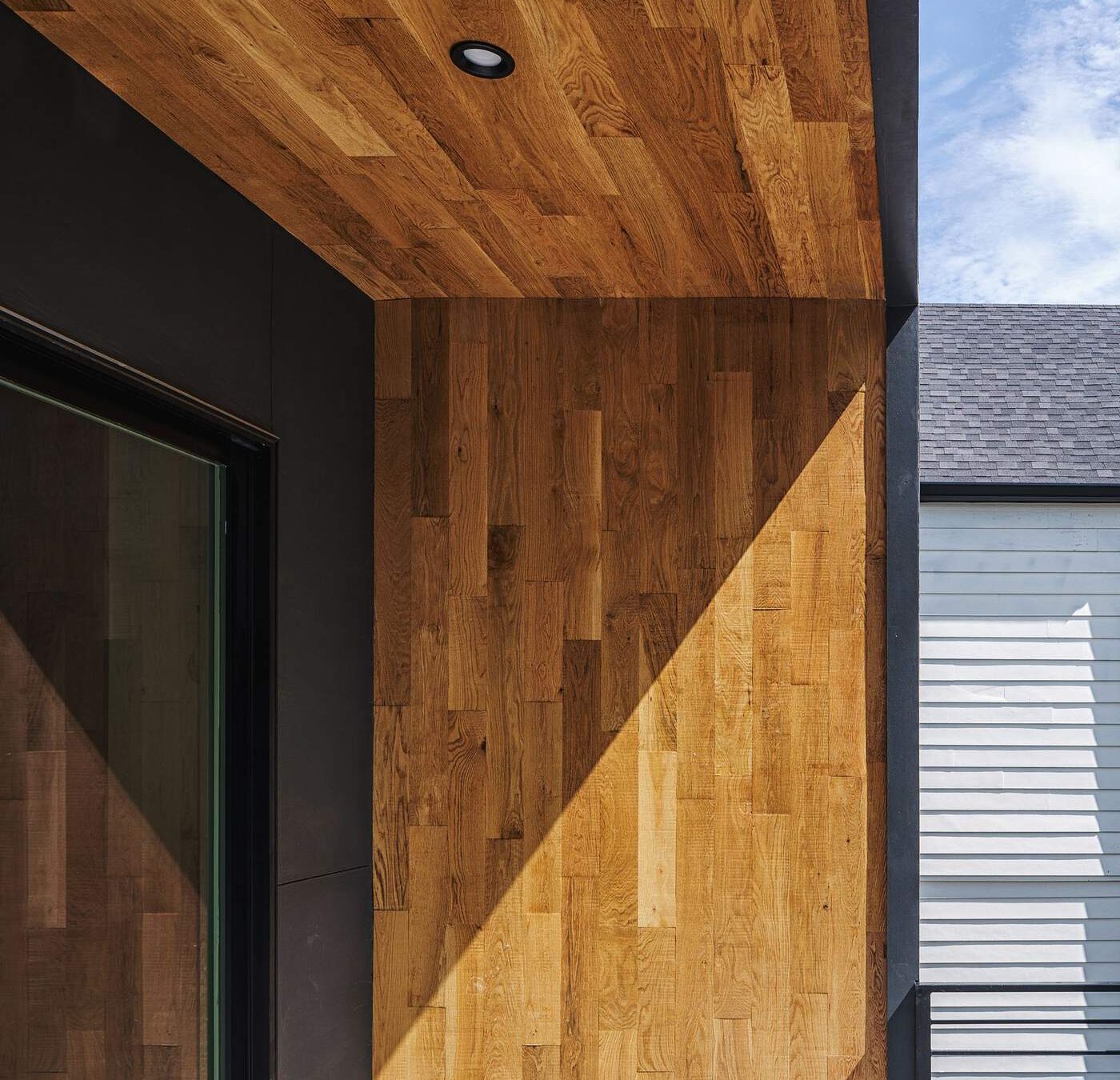 Exterior wood ceiling and siding detail on a custom-built home