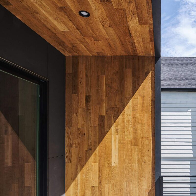 Exterior wood ceiling and siding detail on a custom-built home