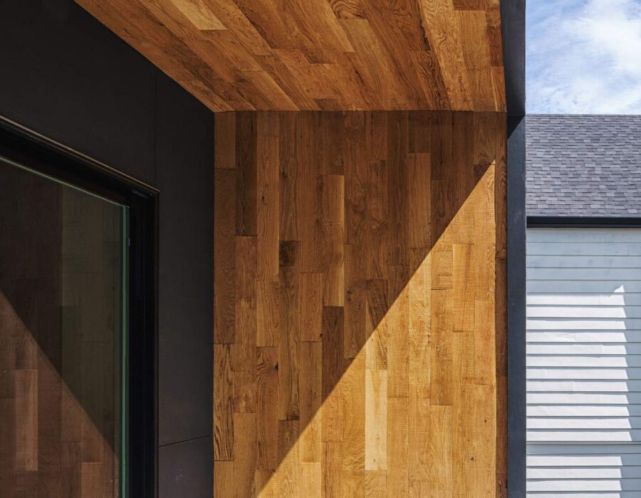 Exterior wood ceiling and siding detail on a custom-built home