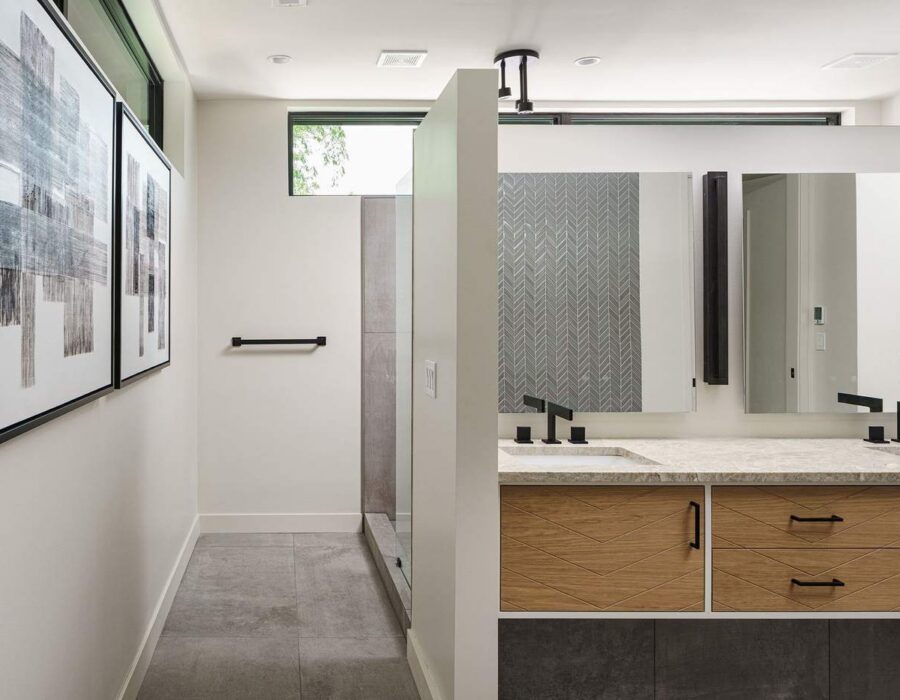 Hallway gallery wall leading to a custom bathroom suite