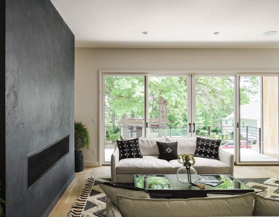 Living room with linear fireplace and custom built-ins