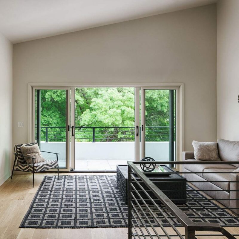 Living room filled with natural light and minimalist furnishings